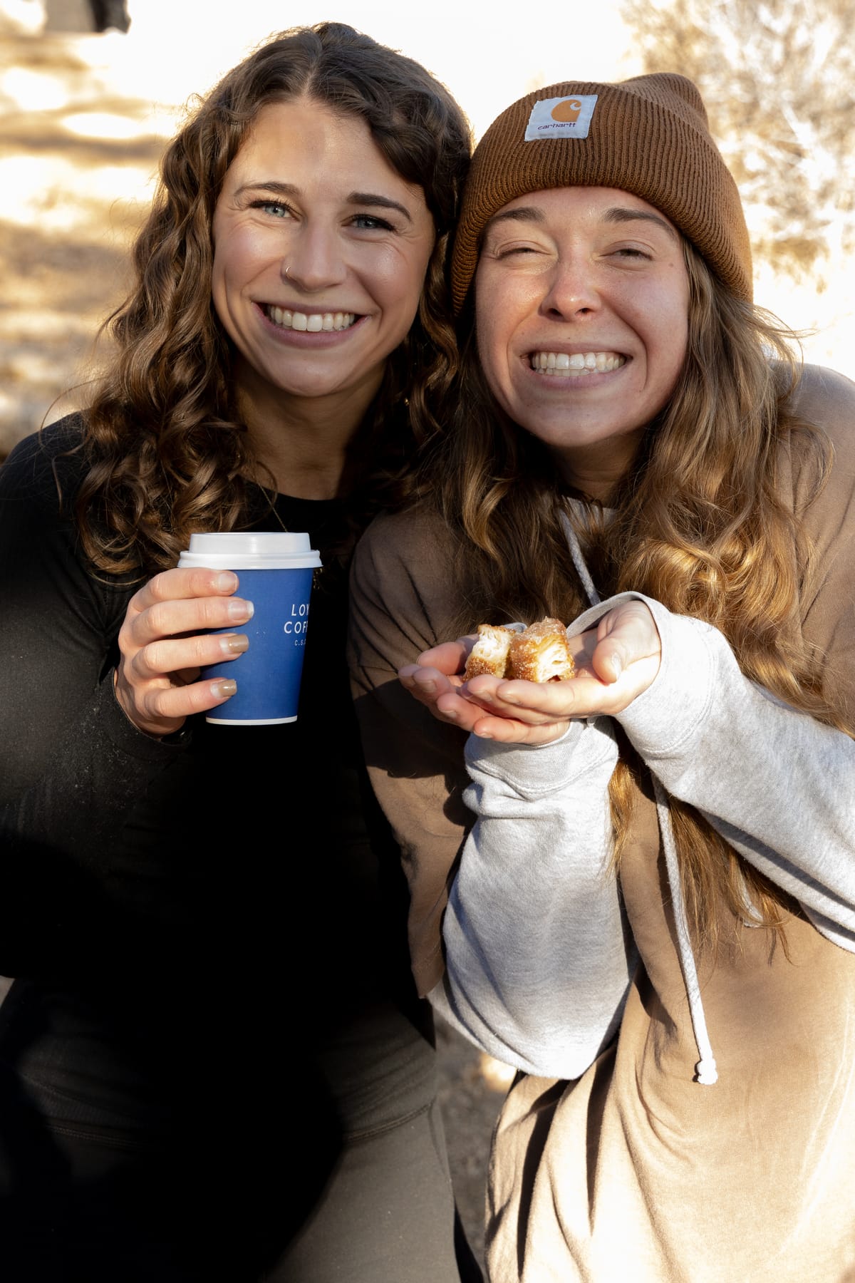 Eden and Abby enjoying coffee and donuts